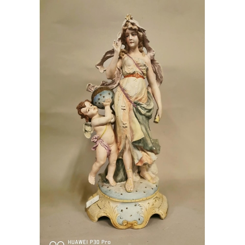 16 - Large ceramic figural group of a Maiden and Cherub {48 cm H x 23 cm W}.