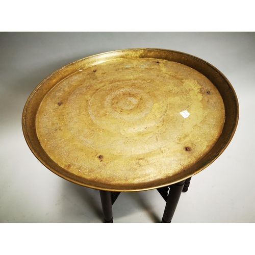 86 - Edwardian brass topped mahogany folding table { 60 cm H x 57 cm Diam}.