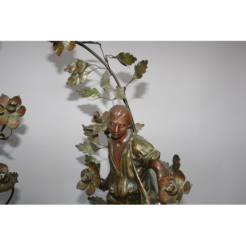 60 - Very fine pair of bronzed lamps in the form of man and woman figures standing on rocky bases. Signed... 