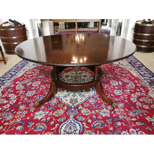 94 - Georgian mahogany breakfast table raised on four tapered columns on circular base and four outswept ... 