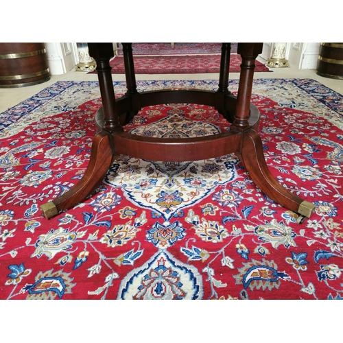 94 - Georgian mahogany breakfast table raised on four tapered columns on circular base and four outswept ... 