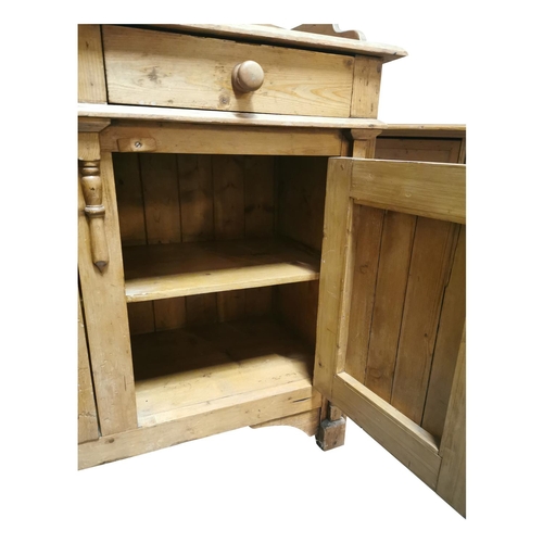 2 - 19th C. Irish Pine cabinet. The shaped gallery back above two short drawers over two panel doors fla... 