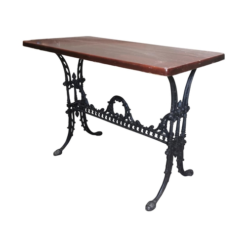 27 - Decorative Cafe table the wooden top raised on cast iron base {72cm H x 100cm W x 52cm D}