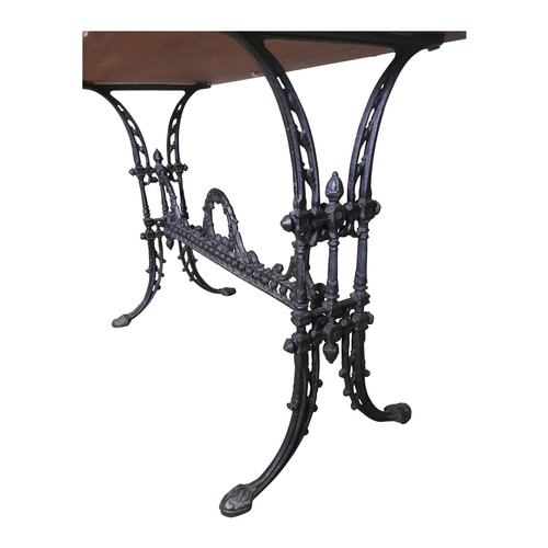 31 - Decorative Cafe table the wooden top raised on cast iron base {72cm H x 100cm W x 52cm D}