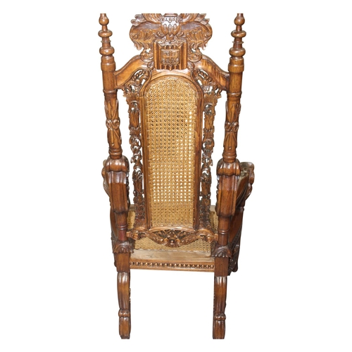 24 - Good quality highly carved mahogany throne chair the arms rests terminating in lion's masks   { 150c... 