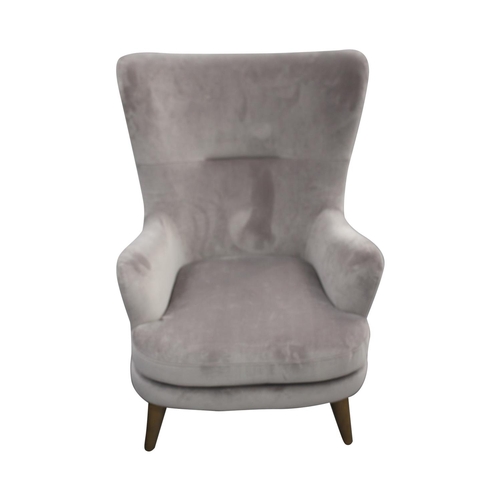 41 - Upholstered Retro design armchair raised on tapered legs { 90cm H x  70cm W x  60cm D}