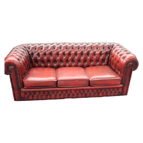 42 - Good quality deep buttoned ox blood leather upholstered three seater Chesterfield sofa { 65cm H x 18... 
