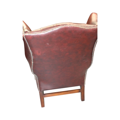 44 - Good quality deep buttoned ox blood leather upholstered wing backed armchair { 110cm H x  80cm W x  ... 