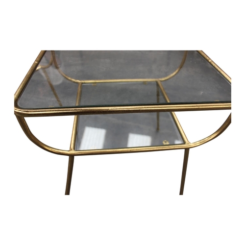 48 - Pair of Retro gilded metal and smoked glass two tier lamp tables  { 46cm H x  47cm W x  40cm D}