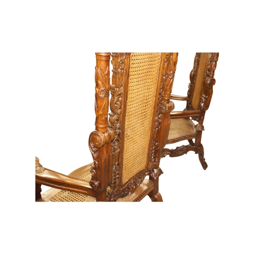 55 - Pair of good quality highly carved mahogany throne chair the arms rests terminating in lion's masks ... 