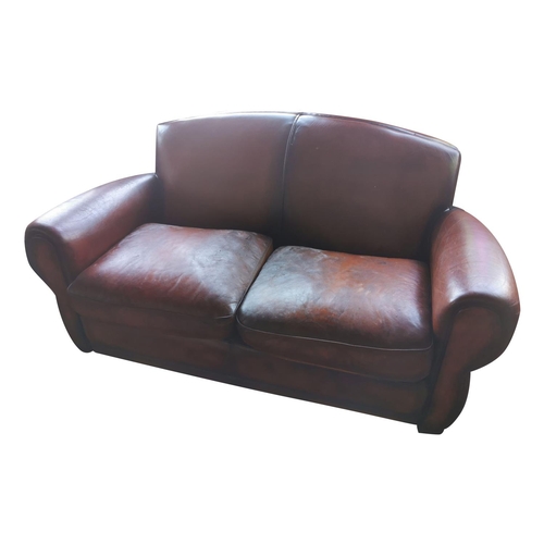 936 - Two seater brown leather sofa. {80 cm H x 155 cm W x 90 cm D}