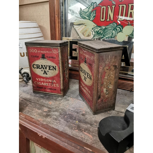 64 - Two Craven A cigarette advertising  tins. {24 cm H x 16 cm W x 9 cm D}.