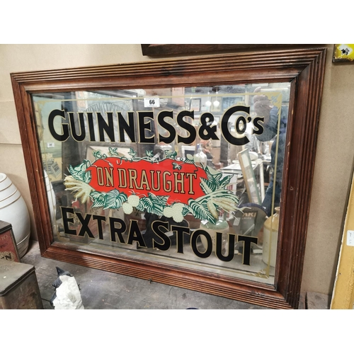 66 - Guinness & Co's on Draught Extra Stout advertising mirror. {69 cm H x 94 cm W }.