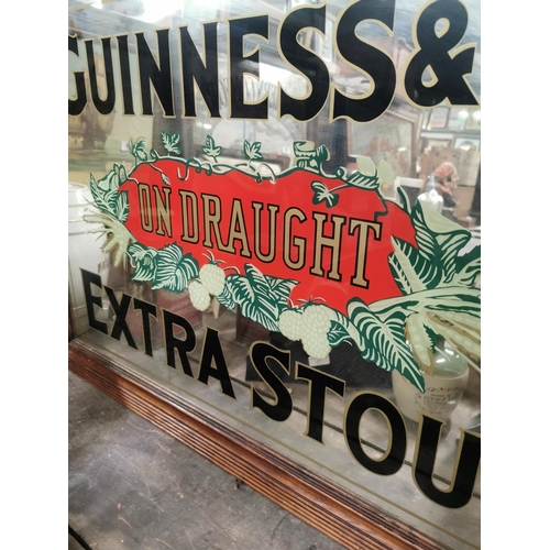 66 - Guinness & Co's on Draught Extra Stout advertising mirror. {69 cm H x 94 cm W }.