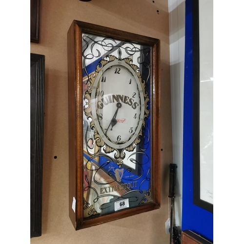 68 - Guinness Extra Stout mirrored advertising clock with wooden case. {53 cm h x 27 cm W x 9 cm D}