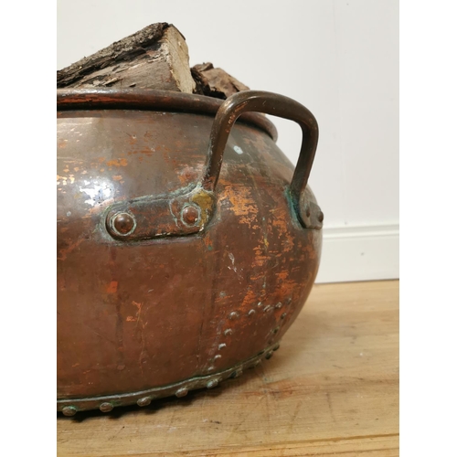 107 - 19th C. hand rivetted metal log bucket. { 28 cm H x 51 cm Diam}.