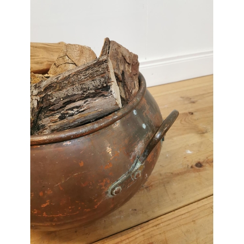 107 - 19th C. hand rivetted metal log bucket. { 28 cm H x 51 cm Diam}.