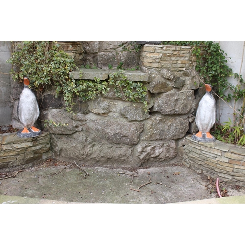 35 - Pair of painted composition stone models of Penguins. {66 cm H x 29 cm W x 27 cm D}.