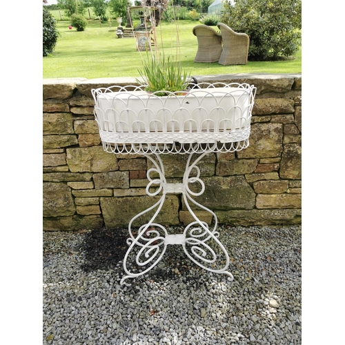 38 - Metal plant stand with liner {95 cm H x 67 cm W x 30 cm D}.