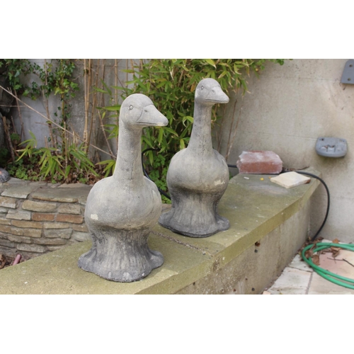 40 - Pair of composite stone models of Geese. {57 cm H x 26 cm W x 48 cm D}.