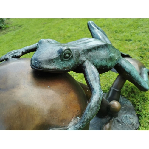 46 - Exceptional quality bronze model of a Frog in motion leaping on a toad stool {54 cm H x 86 cm W x 44... 