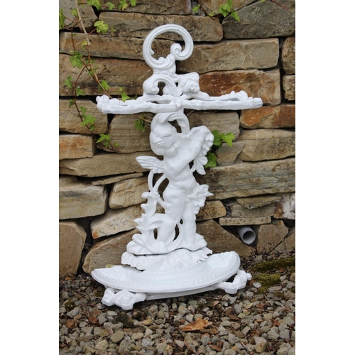 52 - Cast iron stick stand with cherub decoration. {67 cm H x 40 cm w x 18 cm D}.