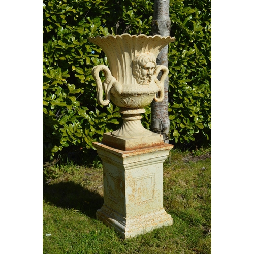 54 - Pair of cast iron urns with mask decoration and serpent handles on matching bases. {200 cm H x 62 cm... 