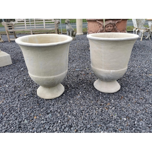 58 - Pair of moulded stone urns {52 cm H x 43 cm Dia.}.