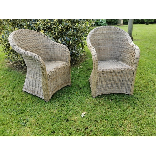 7 - Pair of child's wicker garden arm chairs {70 cm H x 47 cm W x 50 cm D}.