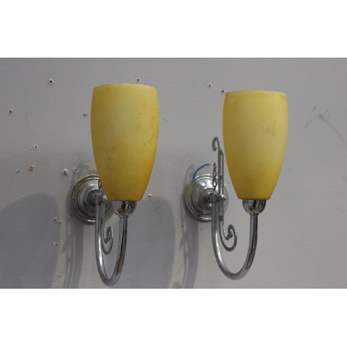 112 - Pair of chrome wall lights with yellow shades {32 cm H x 10 cm W x 26 cm D}.