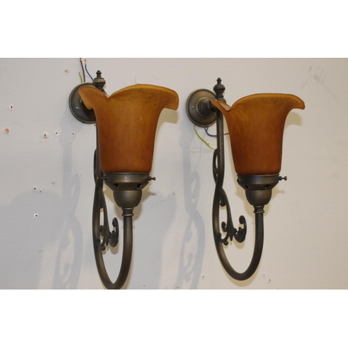 113 - Pair of brass wall lights with amber tulip shades {35 cm H x 15 cm W x 29 cm D}.