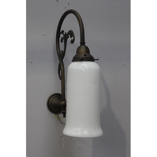 131 - Brass wall light with white glass shade {39 cm H x 12 cm W x 27 cm D}.