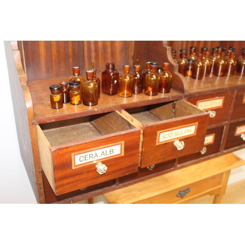 142 - Set of eight chemist drawers with original labels {67 cm H x 113 cm W x 40 cm D}.