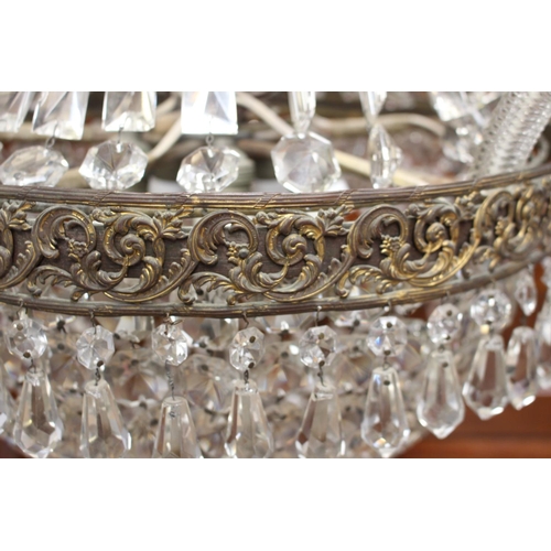 148 - Brass and glass crystal five branch chandelier {100 cm H x 95 cm Dia.}.