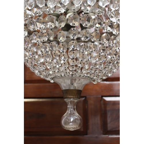 148 - Brass and glass crystal five branch chandelier {100 cm H x 95 cm Dia.}.