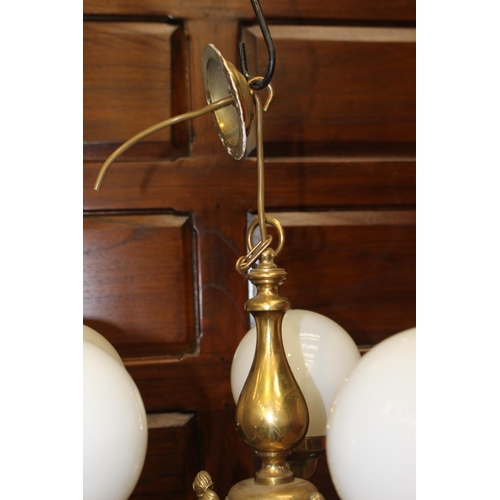 149 - Solid brass five branch chandelier with white glass globes {53 cm H x 60 cm Dia.}.