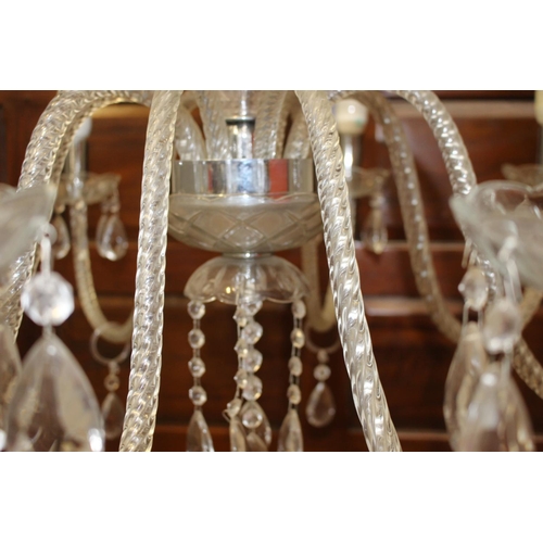 15 - Crystal eight branch chandelier with chrome centre {90 cm H x 80 cm Dia.}.