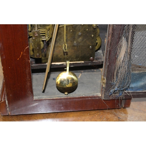 158 - Dome shaped mahogany cased clock {37 cm  H x 28 cm W x 17 cm D}.