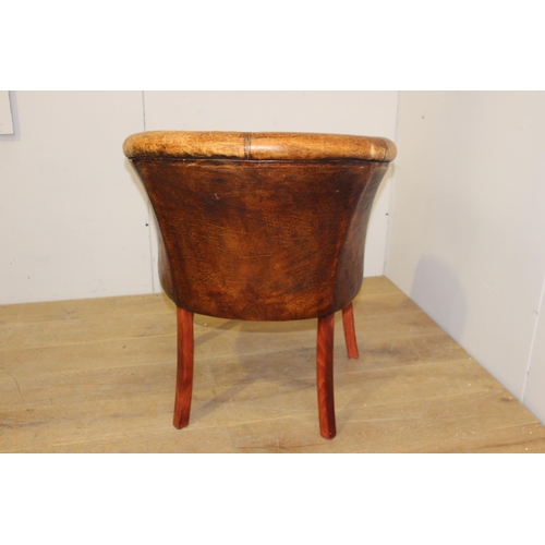 175 - Wooden and tan leather upholstered tub chairs raised on curved tapered legs {82 cm H x 66 cm W x 50 ... 