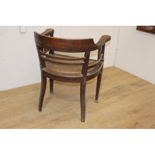 177 - Wooden armchair with brown leather upholstered seat {79 cm H x 66 cm W x 49 cm D}.