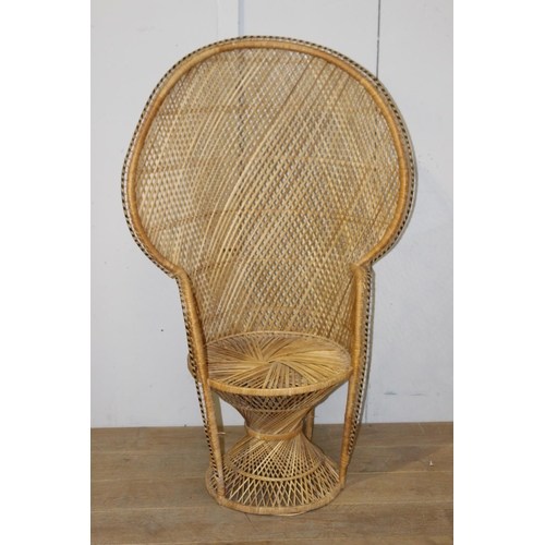 179 - Rattan armchair {137 cm H x 85 cm W x 50 cm D}.