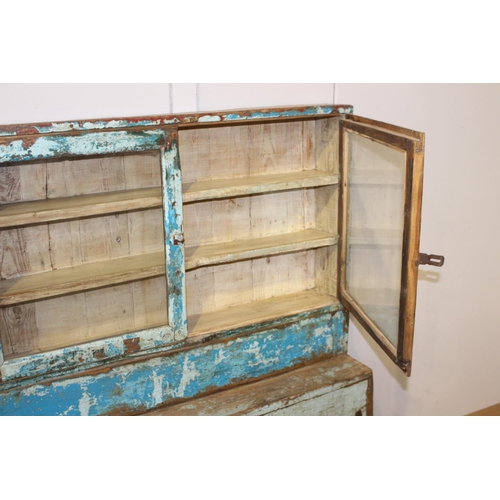 192 - Painted wood stepped three door glass cabinet {125 cm H x 153 cm W x 62 cm D}.