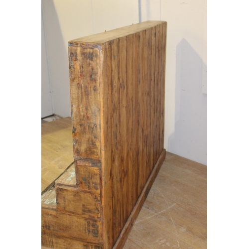 192 - Painted wood stepped three door glass cabinet {125 cm H x 153 cm W x 62 cm D}.