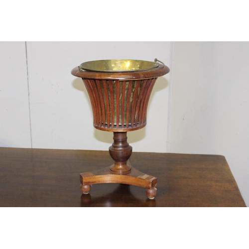 196 - Walnut veneered ice bucket with brass insert {53 cm H x 40 cm Dia.}.