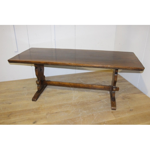 199 - Oak refectory table raised on shaped supports with single stretcher {75 cm H x 198 cm W x 80 cm D}.