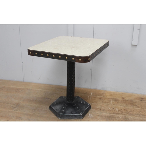 254 - Cast iron studded table with metal top {75 cm H x 60 cm W x 70 cm D}.