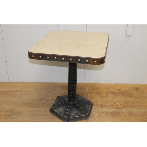 255 - Cast iron studded table with metal top {75 cm H x 60 cm W x 70 cm D}.