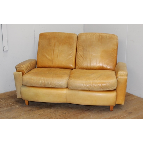 256 - Tan leather upholstered sofa with removable cushions {92 cm H x 146 cm W x 59 cm D}.