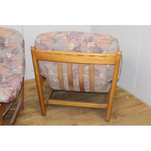 260 - Pair of retro oak and floral upholstered chairs {86 cm H x 86 cm W x 53 cm D}.