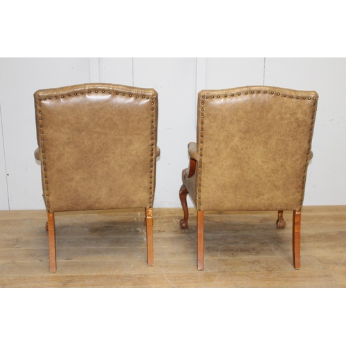 262 - Pair of oak deep buttoned leather armchairs raised on cabriole legs and ball and claw feet {107 cm H... 